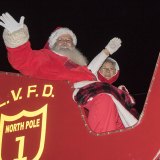 Santa and Mrs. Clause bring up the parade's rear.